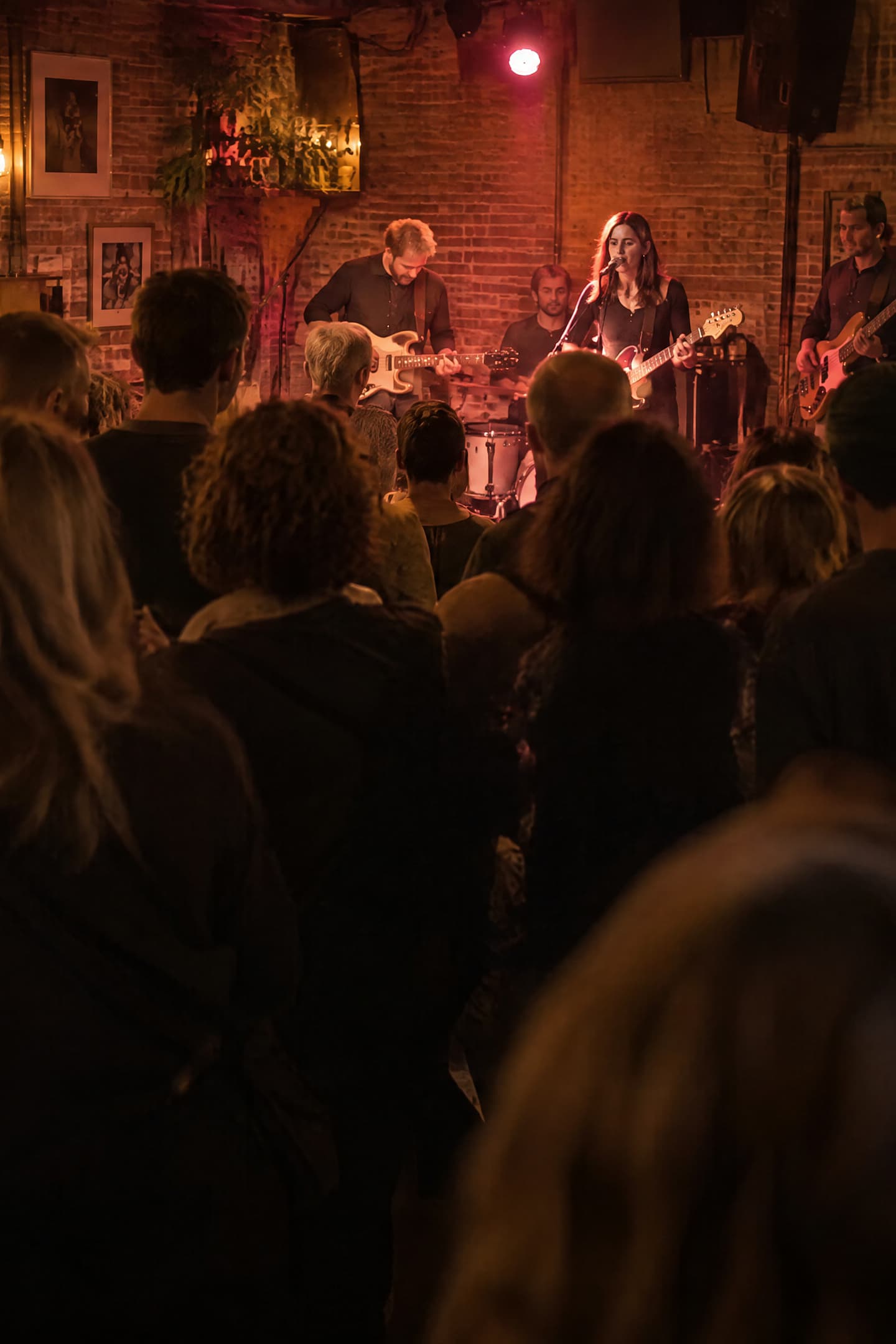 Nights out in the Netherlands: a band in a packed music café, confetti at a big concert, people arriving at a theatre, a club night, a canal-side café terrace and a concert in an old church hall