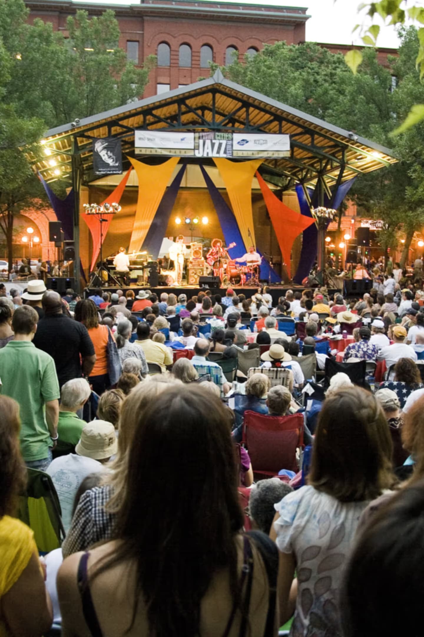 A packed summer-evening crowd at the Twin Cities Jazz Festival stage in Mears Park, Saint Paul