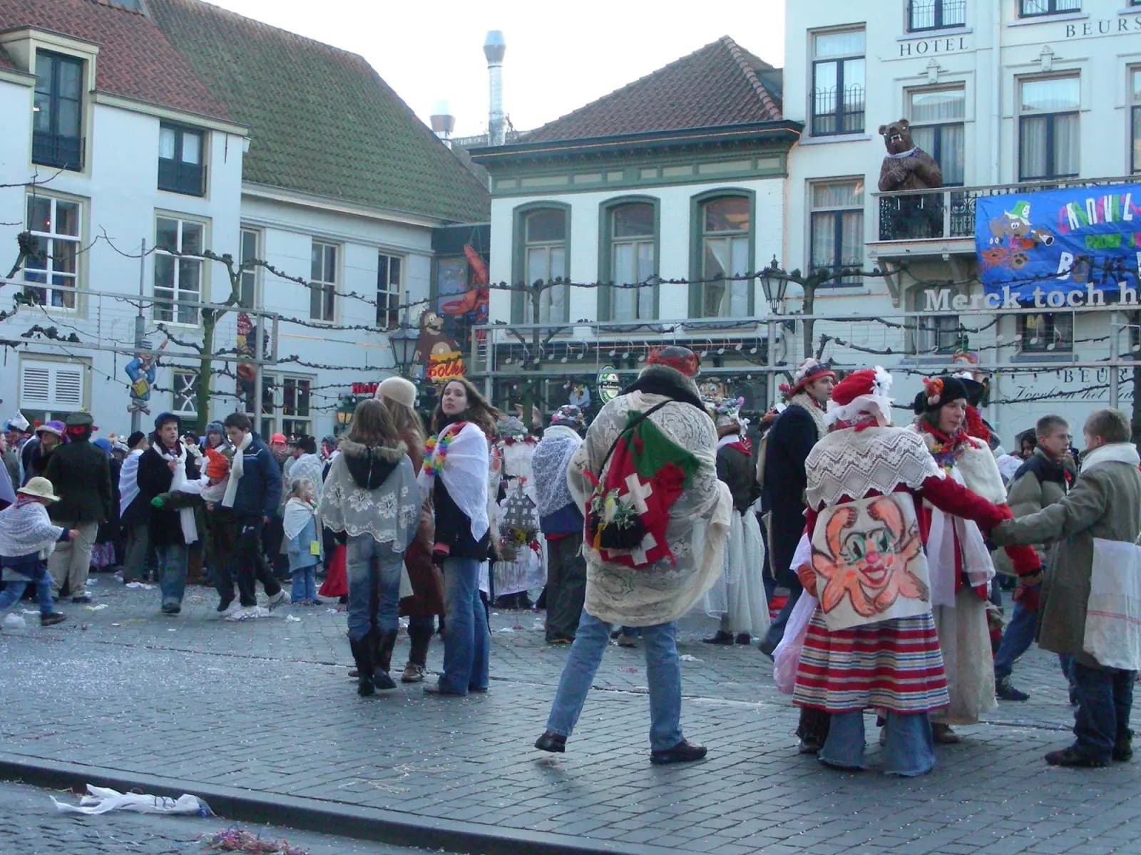 Carnival revellers in Krabbegat costumes on a square in Bergen op Zoom