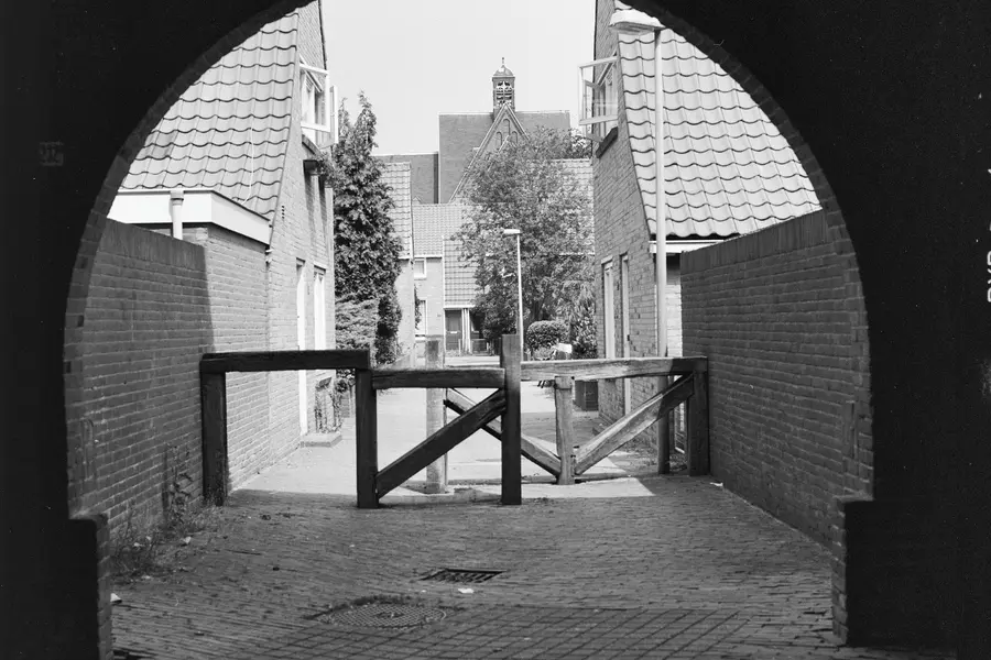 The view from the library's passage towards the Anemonestraat and the church.