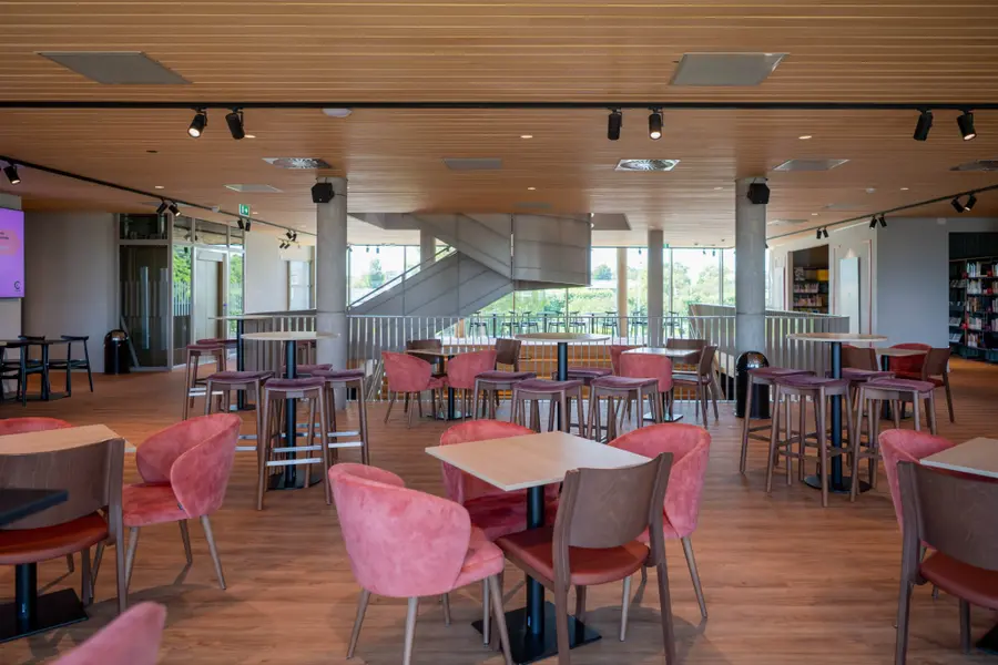 The first-floor Theatre bar at C.C. Cascade, with tables and chairs for drinks before a show.