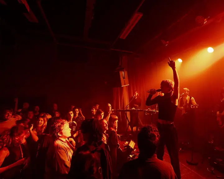 A band performing on stage at Cinetol in Amsterdam.