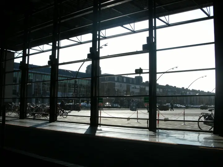The interior of De Meerpaal looking out through its glass wall, with the entrance in view.