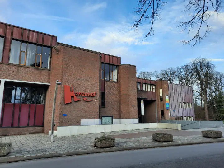 The brick front of Theater Hanzehof with its red Hanzehof lettering, seen from the Coehoornsingel in Zutphen.