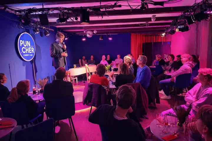 Tables set for the Comedy Diner before a show at Puncher Comedy Club in Alkmaar