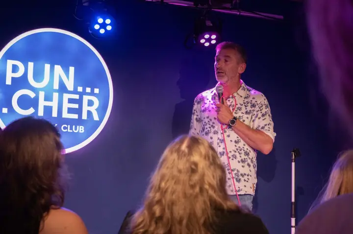 A comedy show on stage at Puncher Comedy Club in Alkmaar
