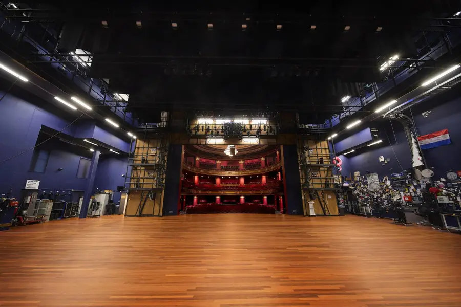 The view from the back of the stage across the Schouwburgzaal, with artists' props on the right wall
