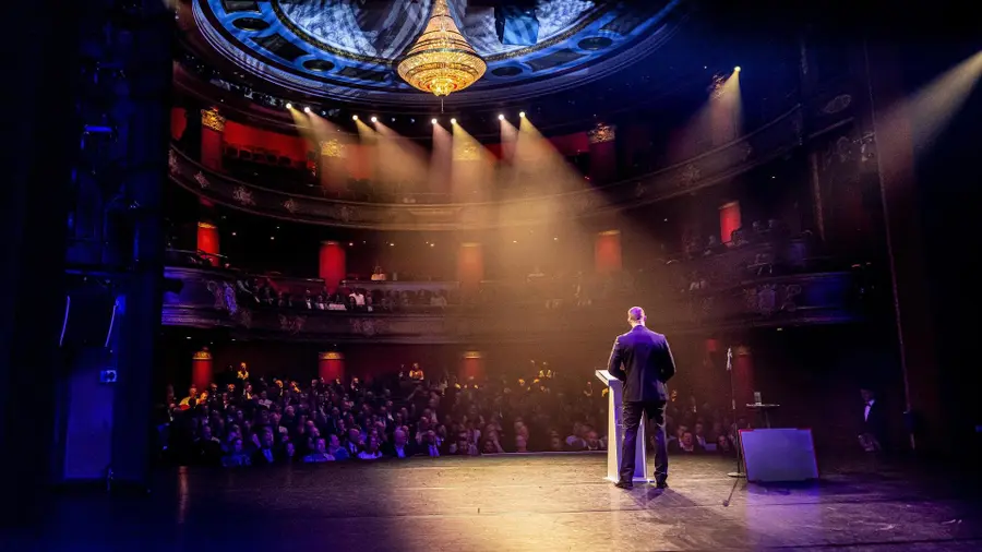 A welcome speech in the Schouwburgzaal of Stadsschouwburg Haarlem