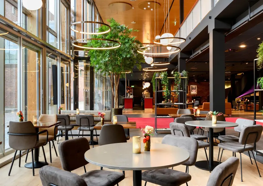 The lower foyer (benedenfoyer) of Theater De Vest in Alkmaar, where visitors gather before a show and in the interval