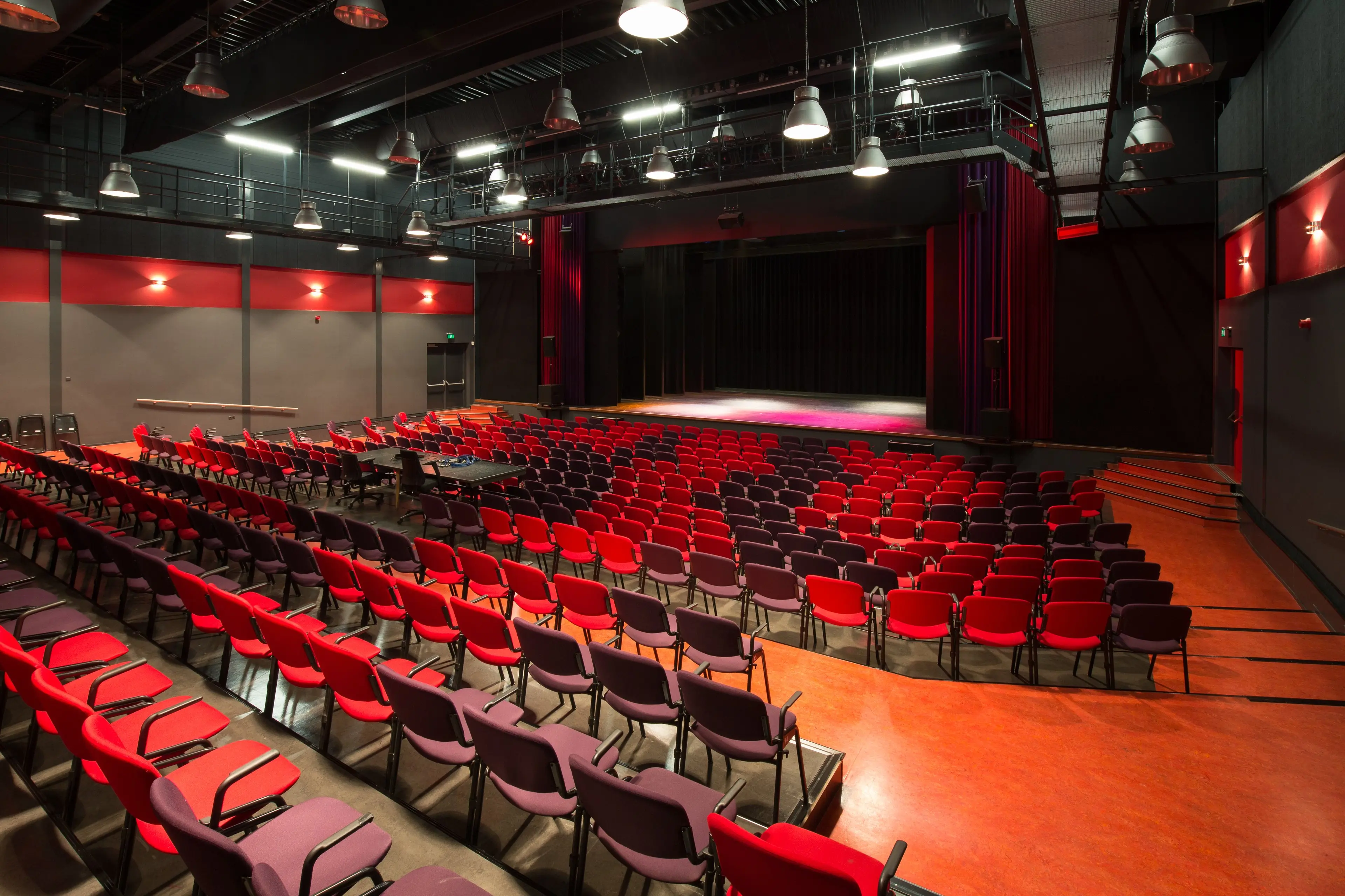The auditorium of Theater De Willem, with rows of seats facing the stage during an open day.