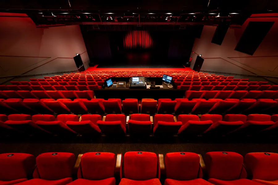 The Nestlézaal at Veluvine, the main theatre hall with its red upholstered seats