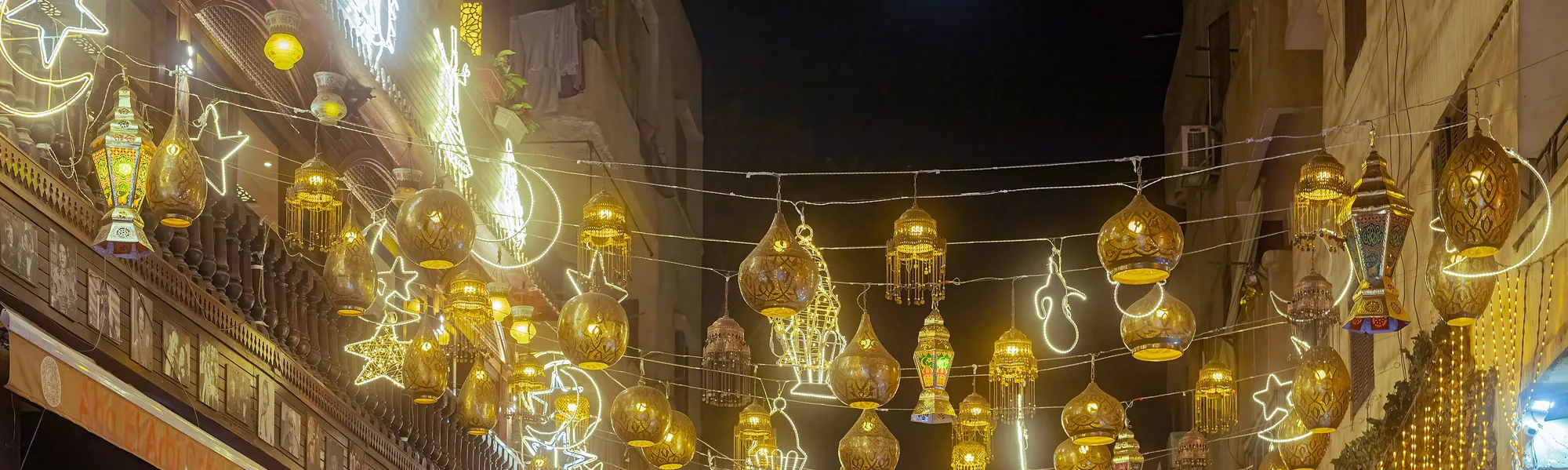 Lanterns and strings of lights hung over a street in Cairo for a Ramadan night